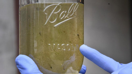 Southern Connecticut State University professor Vincent Breslin holds a sample of water that contains possible microplastics at the North Haven Water Treatment Plant on Universal Drive/UNB
