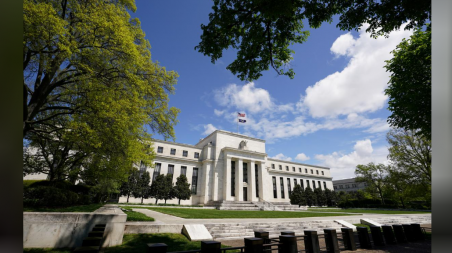 The US Federal Reserve building is set against a blue sky amid the coronavirus pandemic in Washington, US, May 1, 2020. Photo: Kevin Lamarque via Reuters