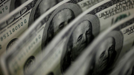 FILE PHOTO: A picture illustration shows U.S. 100 dollar bank notes taken in Tokyo August 2, 2011. REUTERS/Yuriko Nakao/File Photo