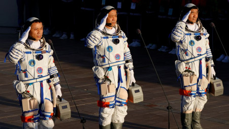 Chinese astronauts Tang Hongbo, Nie Haisheng and Liu Boming salute before the launch of the Long March-2F Y12 rocket, carrying the Shenzhou-12 spacecraft and the three astronauts, from Jiuquan Satellite Launch Center for China's first manned mission to build its space station, near Jiuquan, Gansu province, China June 17, 2021. REUTERS/Carlos Garcia Rawlins