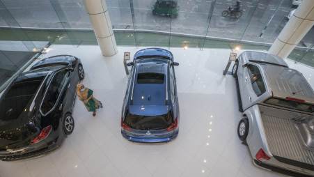 A customer surveys cars in an automobile showroom at the capital’s Tejgaon Link Road. The sales of Japanese reconditioned cars have dropped by almost 40% since the beginning of the pandemic. Traders in the sector continue to suffer as they have not received stimulus support from the government. Photo: Salahuddin Ahmed
