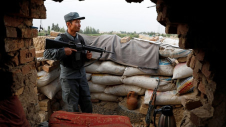 An Afghan policeman keeps watch at the check post on the outskirts of Kabul, Afghanistan July 13, 2021. REUTERS/Mohammad Ismail