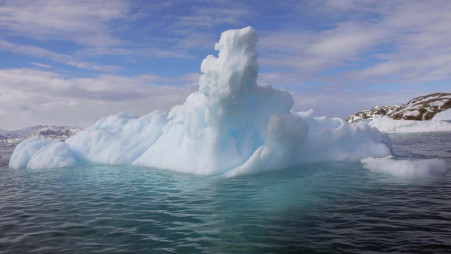 An iceberg floats in a fjord near Tasiilaq. Greenland is strategically important for the U.S. military and its ballistic missile early-warning system since the shortest route from Europe to North America runs via the Arctic island. The United States maintains an air base in Thule in Greenland's northwest under a 1951 treaty with Denmark. Pictures taken June 2018. REUTERS/Lucas Jackson