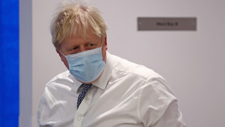 Britain&#039;s Prime Minister Boris Johnson wearing a face covering to help mitigate the spread of Covid-19, reacts during his visit to Milton Keynes University Hospital, north of London, Britain January 24, 2022. Photo :Reuters