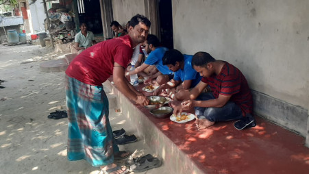 Joynal serving lunch to Sonaichaari hikers. Photo: Courtesy