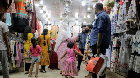 Customers browse through clothing items at a shopping centre at Rankin Street in Wari in Old Dhaka on Thursday. Photo: Mumit M