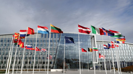 Flags wave outside the Alliance headquarters ahead of a NATO Defence Ministers meeting, in Brussels, Belgium, October 21, 2021. REUTERS/Pascal Rossignol/File Photo