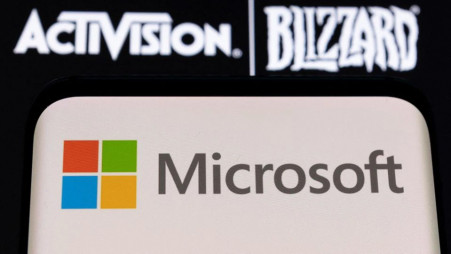 Microsoft logo is seen on a smartphone placed on displayed Activision Blizzard logo in this illustration taken on 18 January 2022. Reuters Illustration