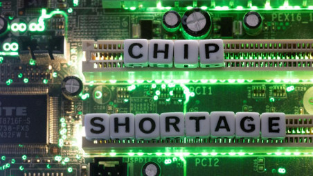 Plastic letters arranged to read "Chip Shortage" are placed on a computer motherboard in this illustration taken, February 20, 2022. REUTERS/Dado Ruvic/Illustration/File Photo