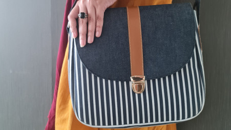Baggitude's Santorini is a messenger bag crafted with denim and leather