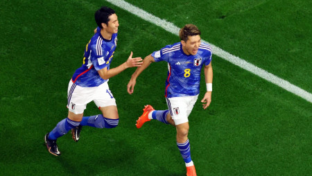 Ritsu Doan celebrates after scoring Japan's first goal in a match CREDIT: Fabrizio Bensch/Reuters