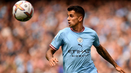 Manchester City's Joao Cancelo heads the ball during the Champions