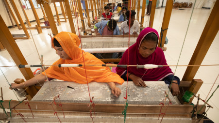 Workers are weaving Muslin sarees at the Dhakai Muslin House at Narayanganj&#039;s Tarabo. At the height of its fame, a yard of fable fabric of Dhaka once could fetch prices ranging from £50 to £400, equivalent to roughly £7,000 to £56,000 today, with even the best silk costing 26 times less. But in the face of British greed and brutality, the industry soon crumbled. Now, if sold, the muslin will again fetch a premium. Photo: Rajib Dhar