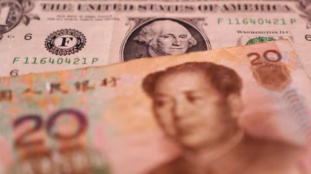 U.S. Dollar and Chinese Yuan banknotes are seen in this illustration taken January 30, 2023. REUTERS