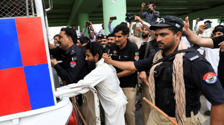 Police officers detain a supporter, after he along with others, gathered for a protest following the arrest of Pakistan&#039;s former Prime Minister Imran Khan, in Peshawar, Pakistan August 5, 2023. REUTERS/Fayaz Aziz