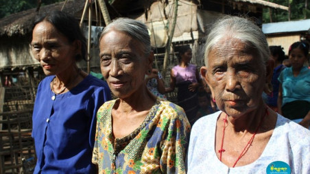 A group of old Chin woman with web spider tattoo on face in village near Mrauk U region in Myanmars Rakhine state. Chin people, also known as the Kukis are a number of Tibeto Burman tribal. Photo: Narinjara