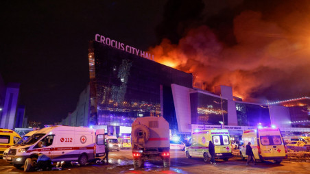 Vehicles of Russian emergency services are parked near the burning Crocus City Hall concert venue following a reported shooting incident, outside Moscow, Russia, 22 March 2024. Photo: REUTERS/Maxim Shemetov TPX IMAGES OF THE DAY