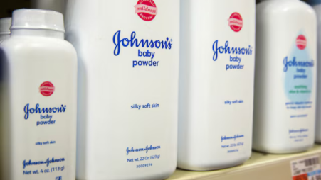 Bottles of Johnson &amp; Johnson baby powder line a drugstore shelf in New York October 15, 2015. REUTERS/Lucas Jackson/File Photo