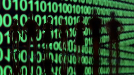 Small toy figures are seen in front of a binary code in this illustration picture, April 8, 2019. Photo: REUTERS/Dado Ruvic/Illustration
