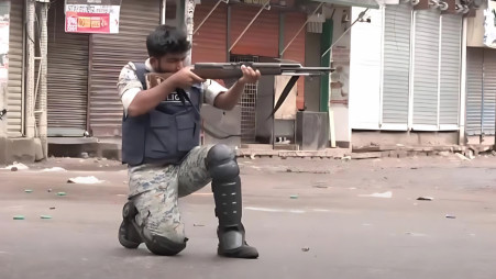 In a video that circulated on social media, Md Sujon Hossain, a member of the Armed Police Battalion (APBn) was seen shooting at people in the capital’s Chankharpul area during the long march programme on 5 August 2024. Screengrab from the video