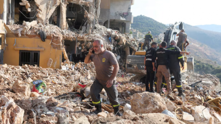 Civil defense members work at a site damaged in the aftermath of an Israeli strike, amid the ongoing hostilities between Hezbollah and Israeli forces, in Barja, Lebanon November 6, 2024. REUTERS/Aziz Taher 