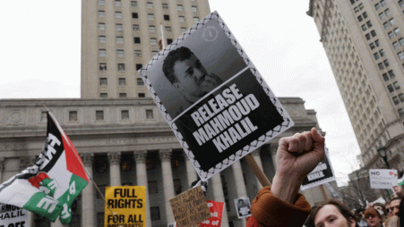 Demonstrators hold placards as they protest on the day of a hearing on the detention of Palestinian activist and Columbia University graduate student Mahmoud Khalil, in New York City on 12 March 2025. Photo: Reuters