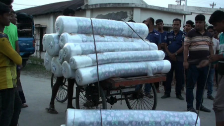Police conducted a raid in Satkhira’s Binerpota area and recovered the stolen garments. Photo: Collected