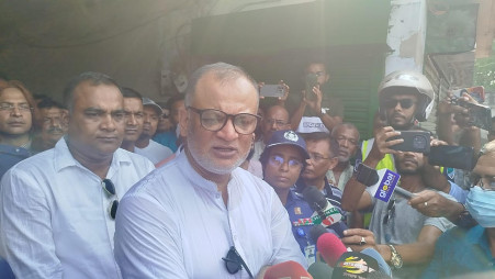 Commerce Adviser Sk Bashir Uddin speaks to journalists after visiting Razarhat – the largest leather market in the South-Western region– in Jashore on 9 June. Photo: Collected