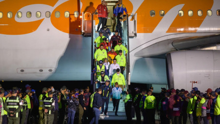 Deported individuals from the US disembark at Simon Bolivar International Airport in Maiquetia, Venezuela. Photo: Bloomberg