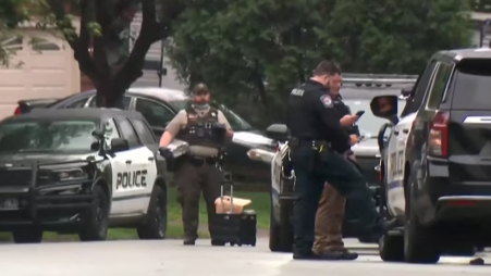 Police stand at a crime scene as they searched for a suspect posing as a police officer who shot two Democratic state lawmakers and their spouses in their homes, in the Minneapolis suburb of Champlin, Minnesota, U.S. June 14, 2025 in a still image from video. ABC Affiliate KTSP via REUTERS