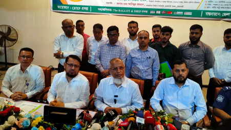 Election Commissioner Md Anwarul Islam Sarker (bottom row, third from left) is pictured at a workshop in Chapainawabganj on 26 September 2025. Photo: UNB