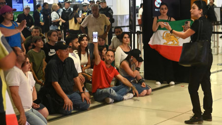 Supporters of the Iranian women's soccer team gather at Sydney Airport, after five of the players were granted asylum, in Sydney, Australia, 10 March 2026. REUTERS/Jeremy Piper 