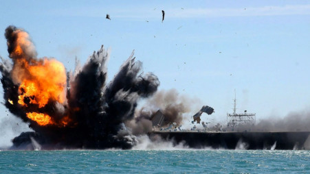 An Iranian-built mockup of a US Nimitz-class carrier is destroyed during the IRGCN Noble Prophet exercise. Photo: Collected