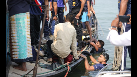 Rescuers recover bodies of passengers from the Padma River after a bus plunged into it from the Daulatdia Ferry Terminal. The accident claimed at least 26 lives, turning a homebound journey into tragedy. Photos: TBS