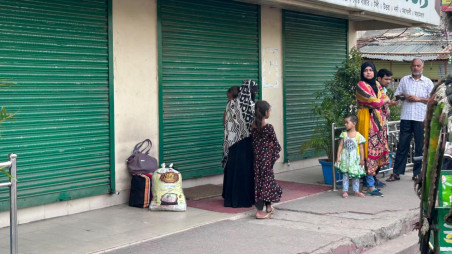 People stand outside a closed bus counter in Rajshahi amid a workers' strike on 18 May 2026. Photo: Collected 