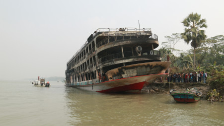 At least 40 passengers were killed and many more went missing when a fire broke out in a Barguna bound launch on the River Sugandha early Friday. Photo: TBS 