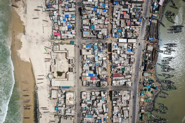 One potential problem with the widespread adoption of satellite tracking devices is the suspicion that authorities will use them to punish stray fishermen.  Above, boats line the seaside district of Guet N'Dar in Saint Louis, Senegal on August 12.  Photographer: John Wessels / AFP / Getty Images / Bloomberg