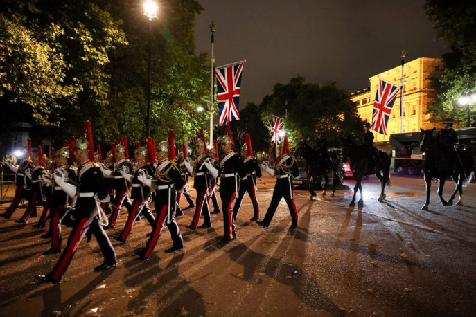 The cortege makes its way on The Mall in a nighttime rehearsal for when the coffin will be moved from Buckingham Palace to Westminster Hall, where Britain&#039;s Queen Elizabeth will lie in state for four days, following her death, in London, Britain September 13, 2022. REUTERS/Kevin Coombs