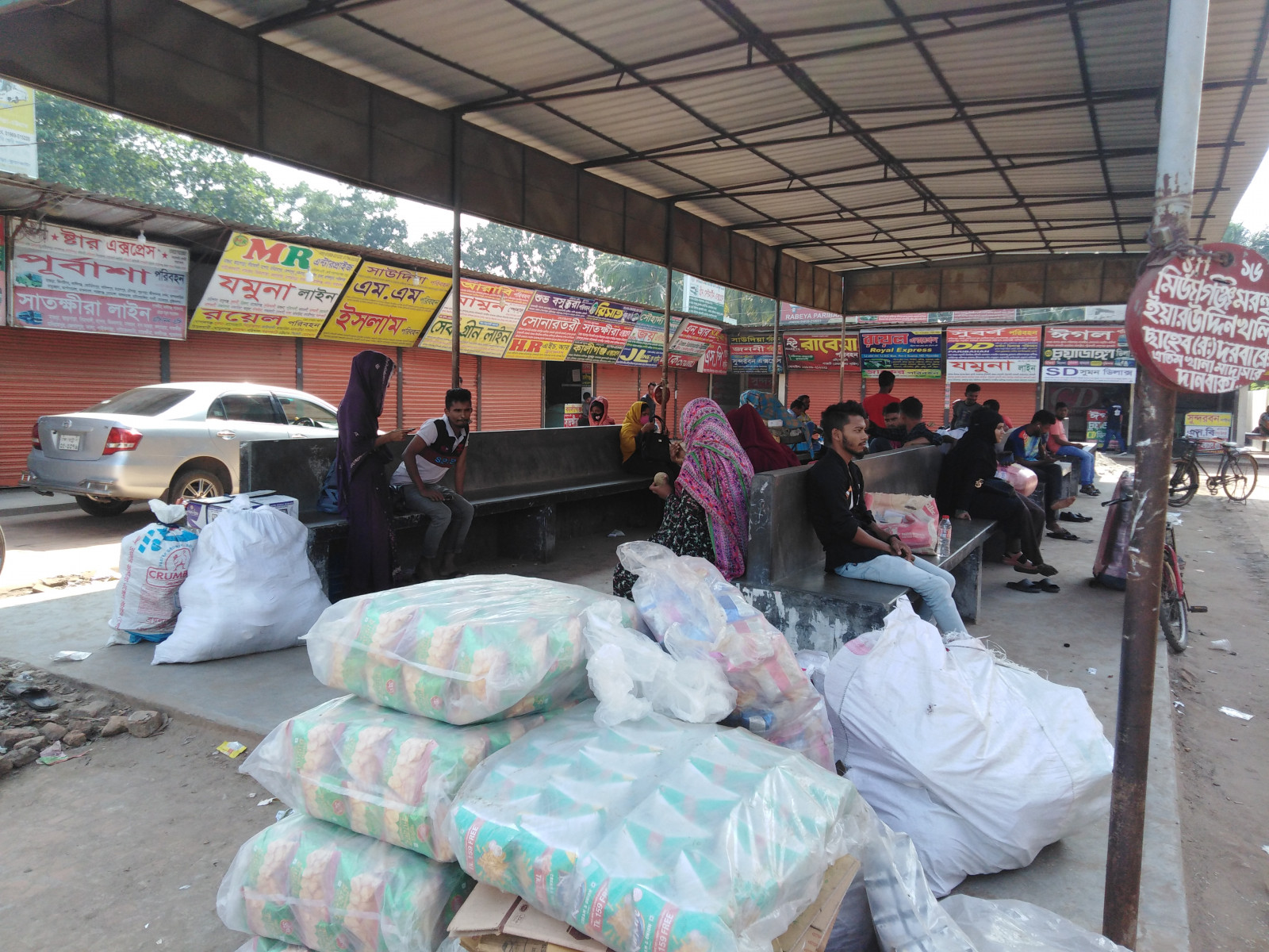 Passengers patiently wait at the terminal as bus counters remain shuttered. Photo: TBS