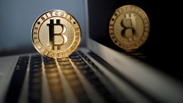 A Bitcoin coin is seen in an illustration picture taken at La Maison du Bitcoin in Paris, France Photo: Reuters
