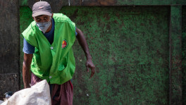 When others are busy protecting themselves from coronavirus,Mujibur Rahman, a DSCC cleaner has to collect household wastes to keep the city clean for others. The photo was taken at Dilu Road at Moghbazar. Photo: Mumit M