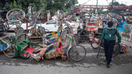 File photo shows battery-run rickshaws flipped over by the side of a street in Dhaka. Photo: Mumit M/TBS