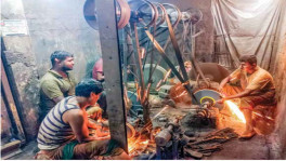 Workers sharpening scissors at a factory in Pabna. Photo: TBS