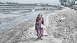 I started walking in the early morning. Before the sun sets, I return to our village. I walk miles after miles and sell homemade crackers. My husband died 35 years ago. My only daughter is severely ill. Photo: Mohammad Rakibul Hasan 
