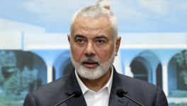 In this photo released by Lebanese government, Ismail Haniyeh, the leader of the Palestinian militant group Hamas, speaks during a press conference after meeting with Lebanese President Michel Aoun, at the presidential palace, in Baabda, east of Beirut, Lebanon, Monday, June 28, 2021. Hamas said Wednesday, Dec. 20. 2023, its top leader, Ismail Haniyeh, has arrived in Cairo for talks on the war in Gaza. (Dalati Nohra/Lebanese Official Government via AP, File) (Dalati Nohra / Associated Press)