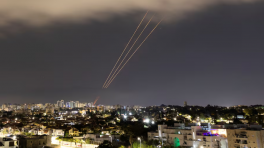 An antimissile system targets an Iranian aerial attack on Israel early Sunday. (Amir Cohen/Reuters)