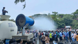 Dhaka North City Corporation spraying water using its spray cannon amid extreme heat in Agargaon, Dhaka on Saturday, 27 April 2024. Photo: TBS