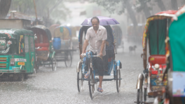 A rickshaw puller passing over Eskaton Garden road on a rainy afternoon some time during Ramadan. Photo: Syed Zakir Hossain/ TBS