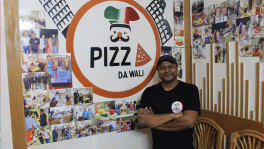 Wali Ullah, the owner and head chef of Pizza Da Wali, stands proudly in front of his restaurant in Gulshan-2. Hidden in a cosy, unmarked flat near embassies, the restaurant has developed a loyal clientele, including over 250 Italians who are regular visitors looking for the taste of home-cooked meals. Photo: Faiyaz Ahnaf Samin 