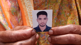Mobina Begum holds a picture of her deceased son. Photo: TBS